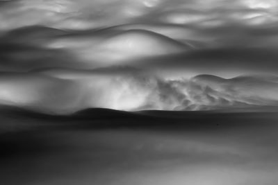 Scenic view of sea against storm clouds