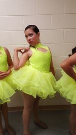 Jazz dancers dancing against wall