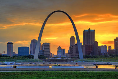 Scenic view of buildings against sky during sunset