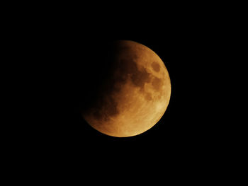 Low angle view of moon against sky at night