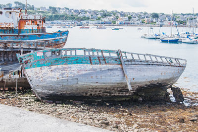 Boats moored on sea shore