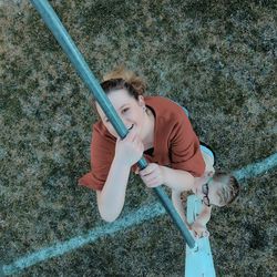 High angle view of girl holding umbrella