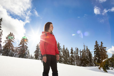 Man standing on snow covered land