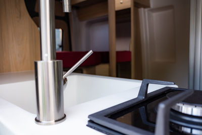 Close-up of empty chair on table at home