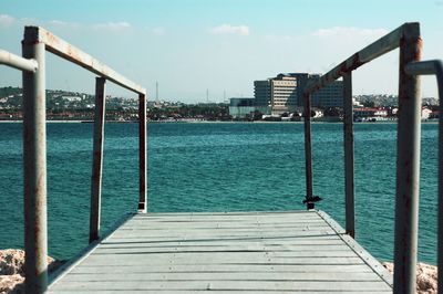 Pier over sea against sky