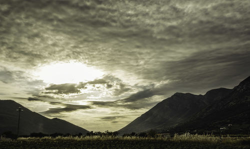 Scenic view of field against sky during sunset