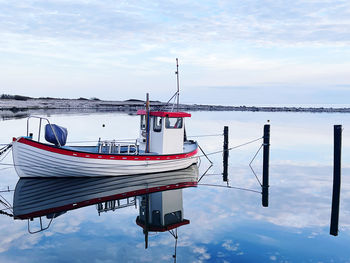 Boats in sea against sky