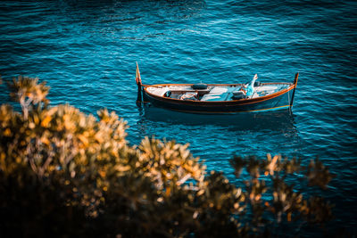 High angle view of sailboats moored on sea