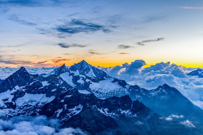 Scenic view of mountains against sky during sunset