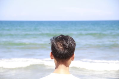 Rear view of woman looking at sea