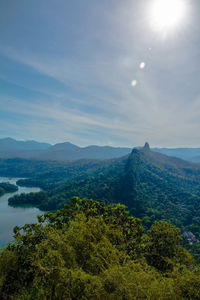 Scenic view of tree mountains against sky