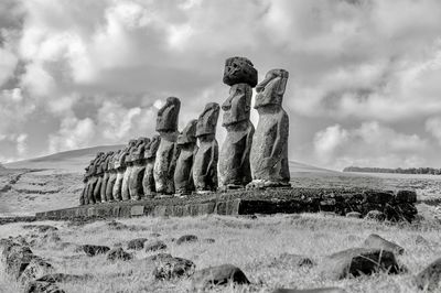 Old statue against sky, moai 