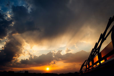 Low angle view of dramatic sky during sunset