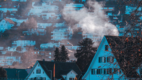 Digital composite image of buildings and trees against sky