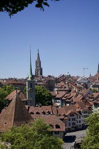 Townscape against clear blue sky