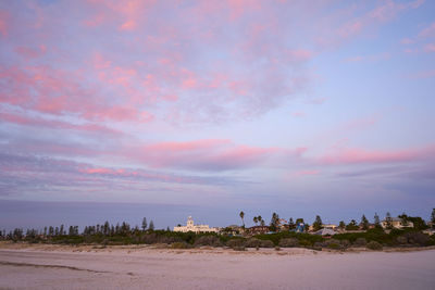 Scenic view of beach against sky during sunset