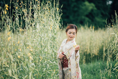 Woman standing on field
