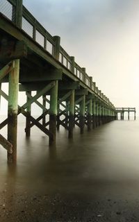 Bridge under construction against sky