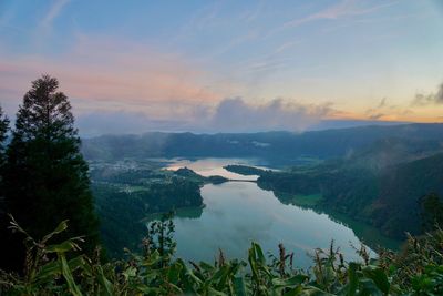 Scenic view of lake against sky during sunset