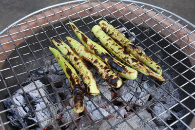 High angle view of meat on barbecue grill