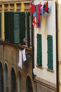 Low angle view of clothes drying on building