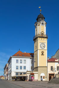 Clock tower on slovak national uprising square in banska bystrica, slovakia