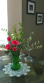 Close-up of flower vase on table at home