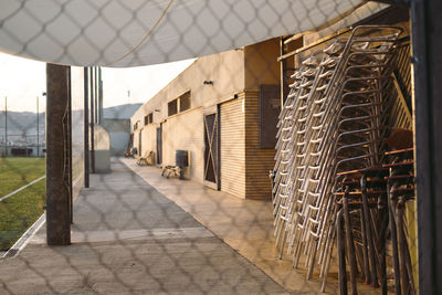 Footpath amidst buildings in city