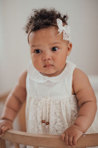 Portrait of cute baby girl at home