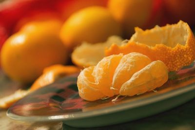 Close-up of orange slice in plate