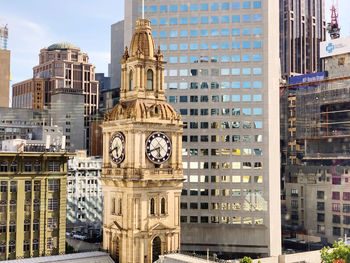 Clocktown surrounded by buildings in city