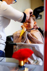 Cute child in hair salon