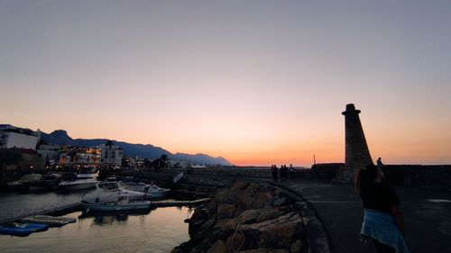 View of harbor at sunset