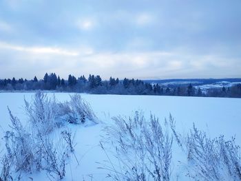 Scenic view of frozen lake against sky