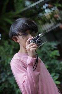 Portrait of woman photographing