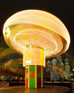 Illuminated ferris wheel at night