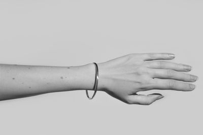 Close-up of hands over white background