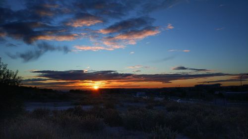 Scenic view of landscape against sky during sunset