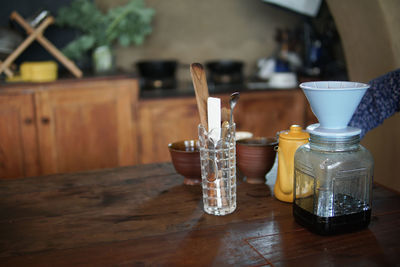 Close-up of glasses on table at home