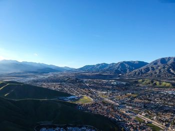 Scenic view of mountains against clear blue sky