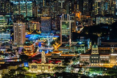 High angle view of illuminated buildings in city at night