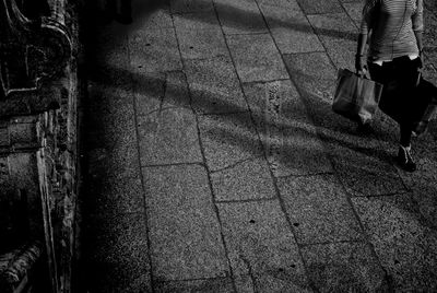 Low section of people standing in the dark