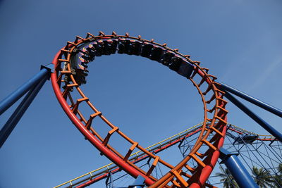 Low angle view of rollercoaster against sky