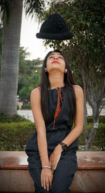 Young woman sitting in park