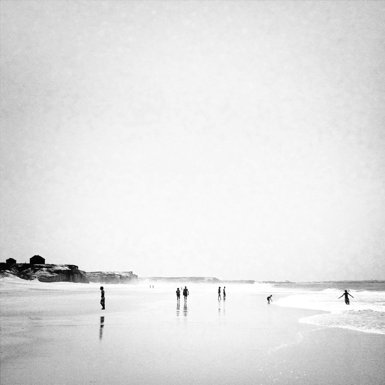 beach, sea, copy space, clear sky, water, horizon over water, leisure activity, large group of people, shore, lifestyles, vacations, sand, men, tranquil scene, person, tranquility, scenics, walking, enjoyment