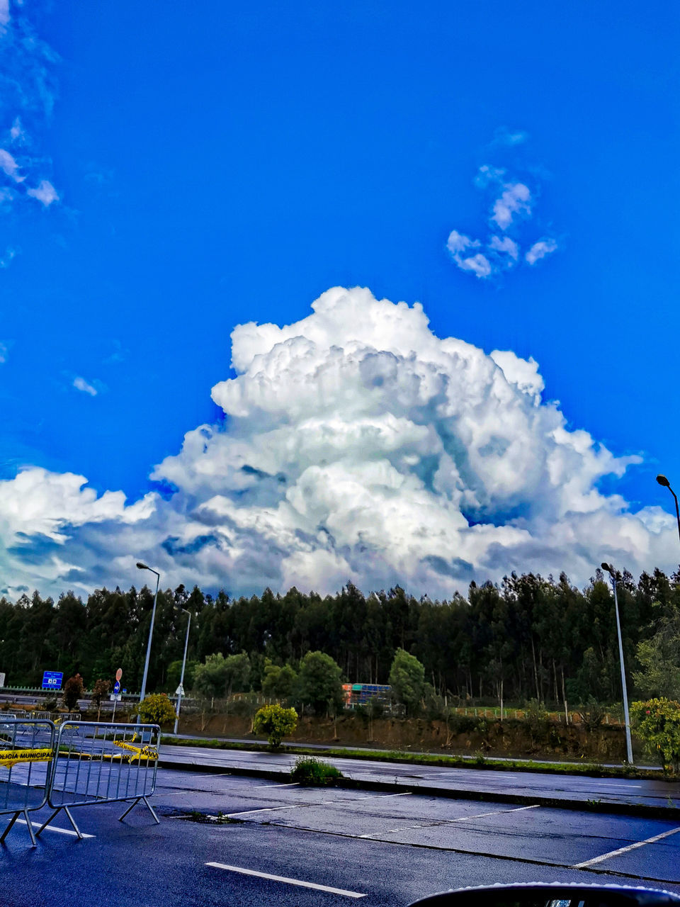 SCENIC VIEW OF ROAD AGAINST BLUE SKY