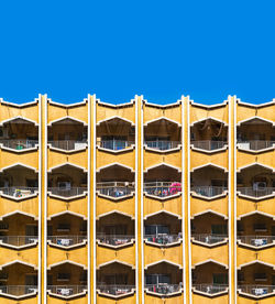 Low angle view of building against blue sky