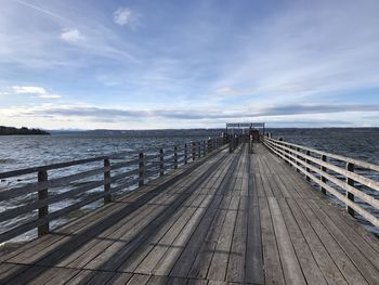 Pier over sea against sky