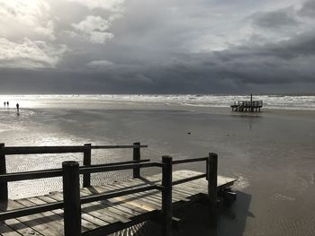 Pier on sea against sky