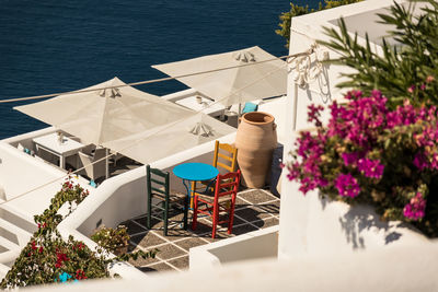 High angle view of potted plants on table by sea